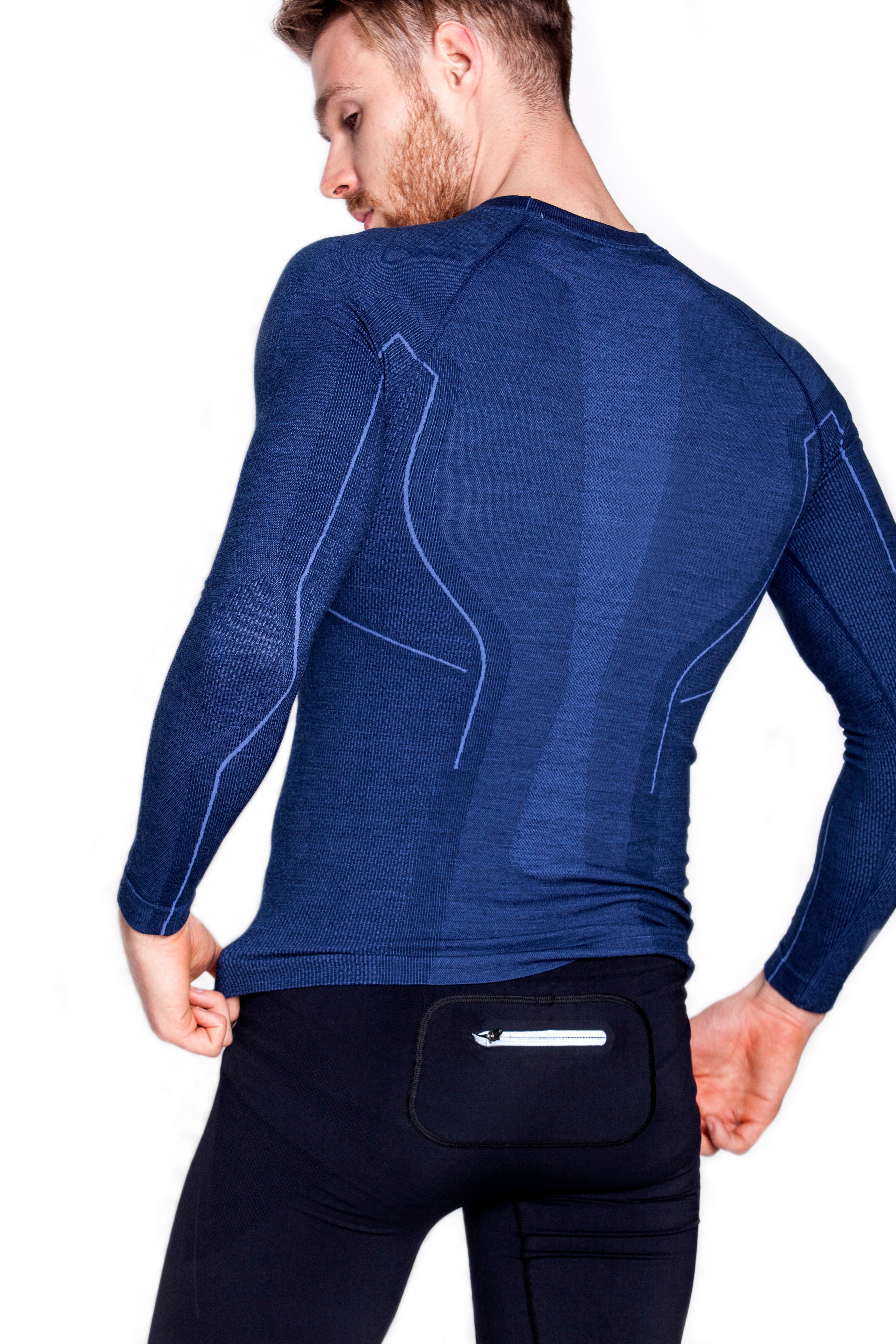 Men's navy blue ACTIVE WOOL long-sleeve shirt. Paired with black men's fitted cycling shorts. 