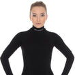 Load image into Gallery viewer, Solid Black women&#39;s EXTREME WOOL high-neck long-sleeve. Pictured from the front with matching EXTREME WOOL leggings