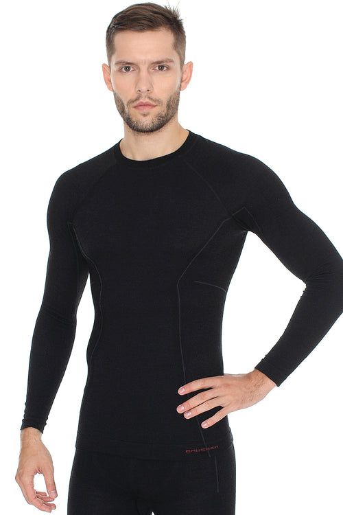 Men's sleek black ACTIVE WOOL long sleeve crewneck base layer. Pictured with matching ACTIVE WOOL workout leggings