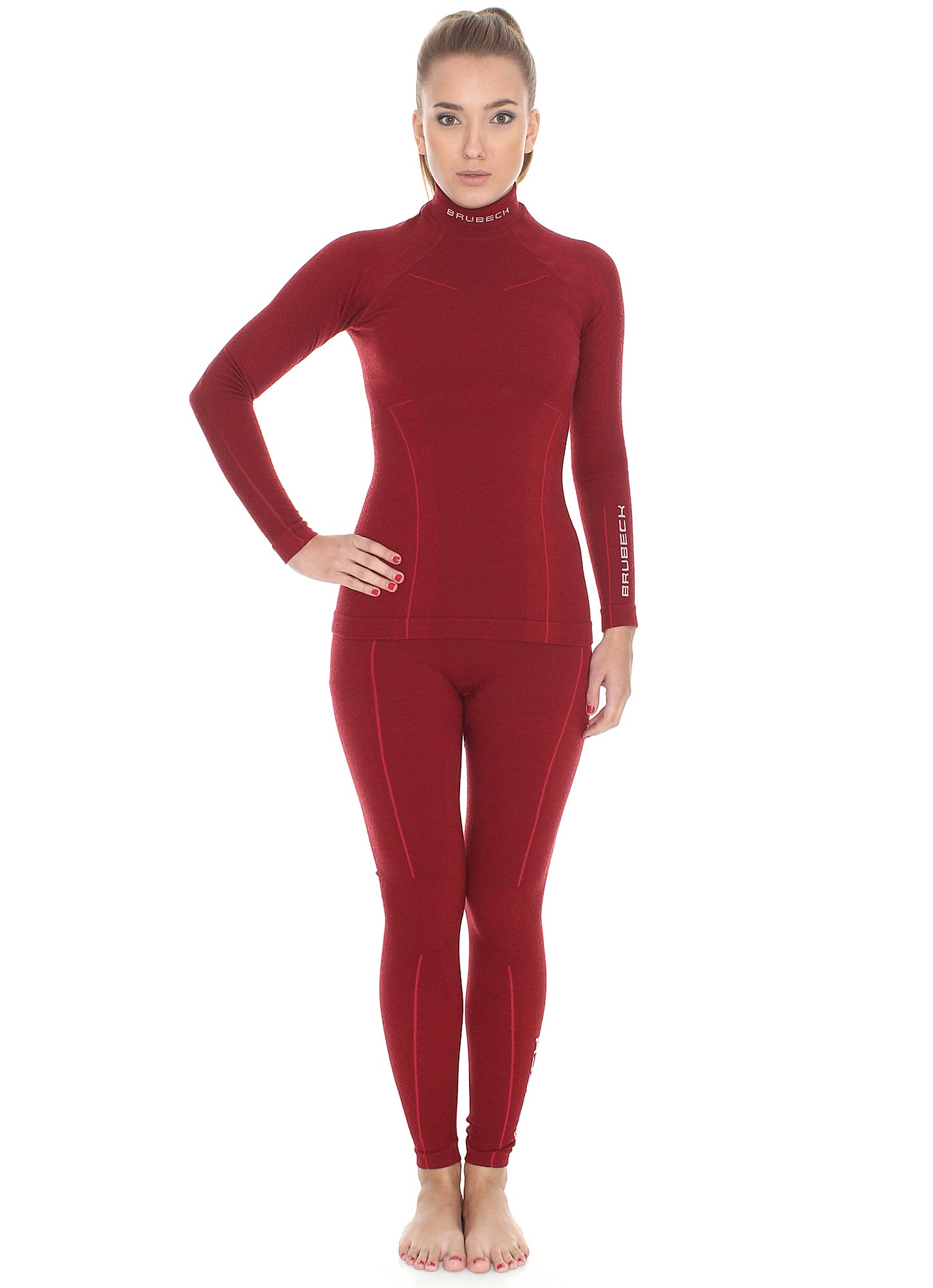 Women's EXTREME WOOL monochromatic red leggings and matching long-sleeve set. With lighter red shape enhancing lines flowing down the sides of the garments. 